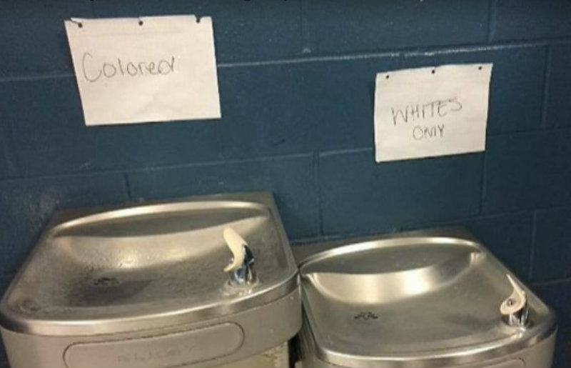 ‘Whites Only’ and ‘Colored’ Signs Taped over School Water Fountains
