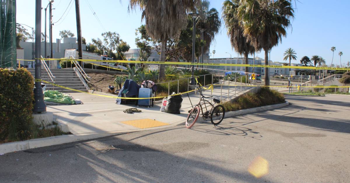 Man arrested after hitting Black man and woman with pipe