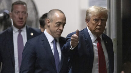 Former President Donald Trump returns from a break at Manhattan criminal court in New York.