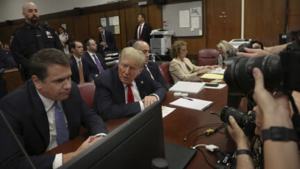 Donald Trump, on the right, talks to his lawyer Todd Blanche, on the left, in a Manhattan courtroom on May 28, 2023