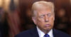Donald Trump sighs during a press conference.