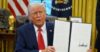 President Donald Trump holds up a signed executive order in the Oval Office of the White House, Monday, Feb. 3, 2025, in Washington (AP Photo/Evan Vucci).