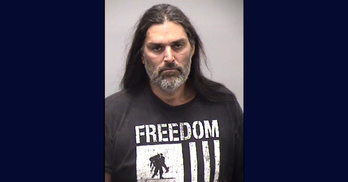 'A human skull': Agitated man charged with murder after 'talking about a cremation' leads to burned 'skeletal remains' being found on his property, authorities say