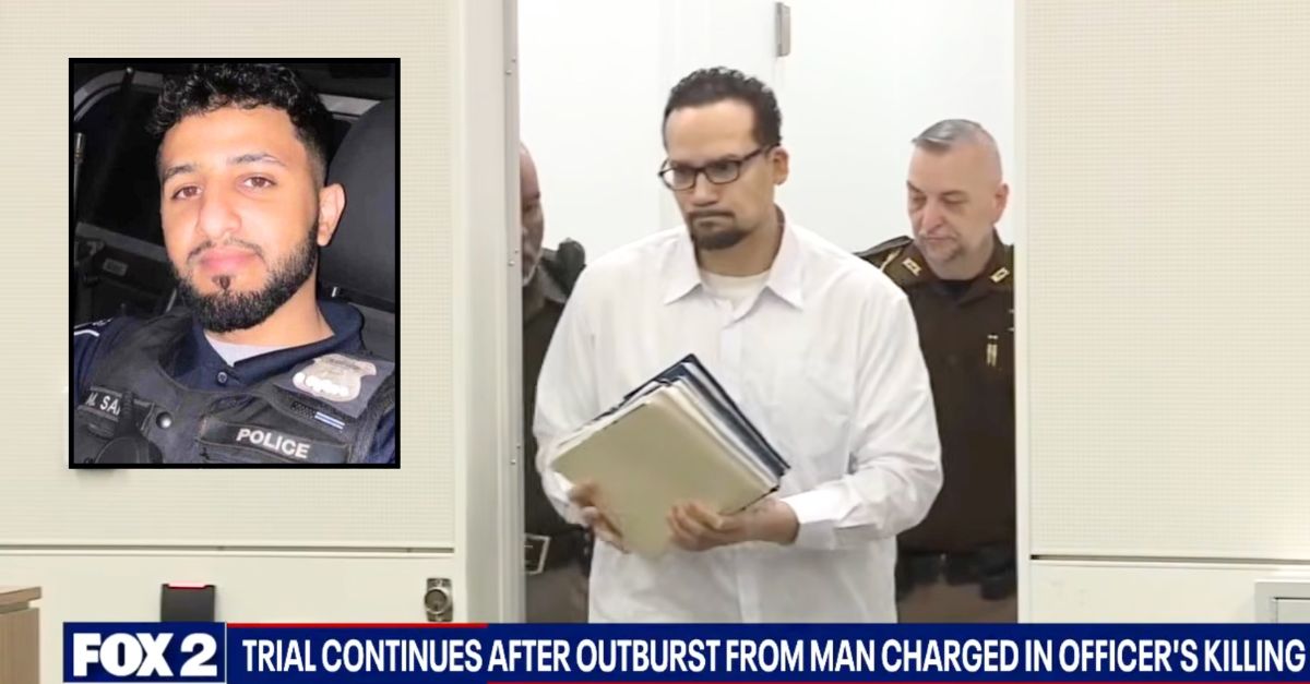 Man accused of killing cop barred from courtroom after he snaps at his attorney